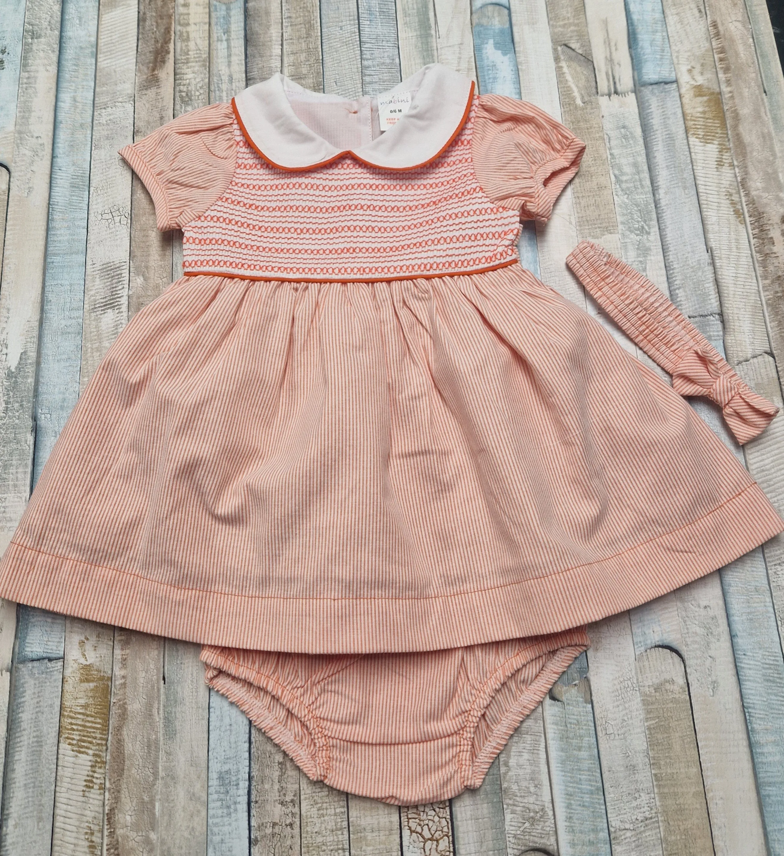 Baby Girls Peach And White Smocked Dress With Matching Pants And Headband
